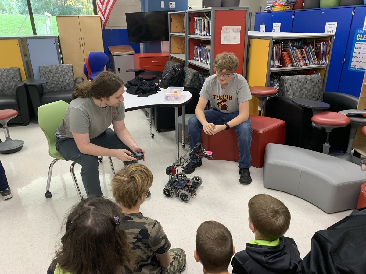 High school engineering students presenting their robot