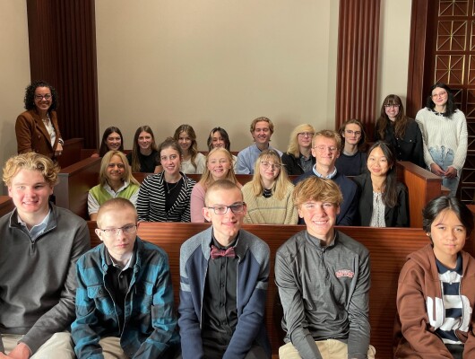 Students pose for a photo while visiting the First District Court of Appeals through the Community Partnership program.