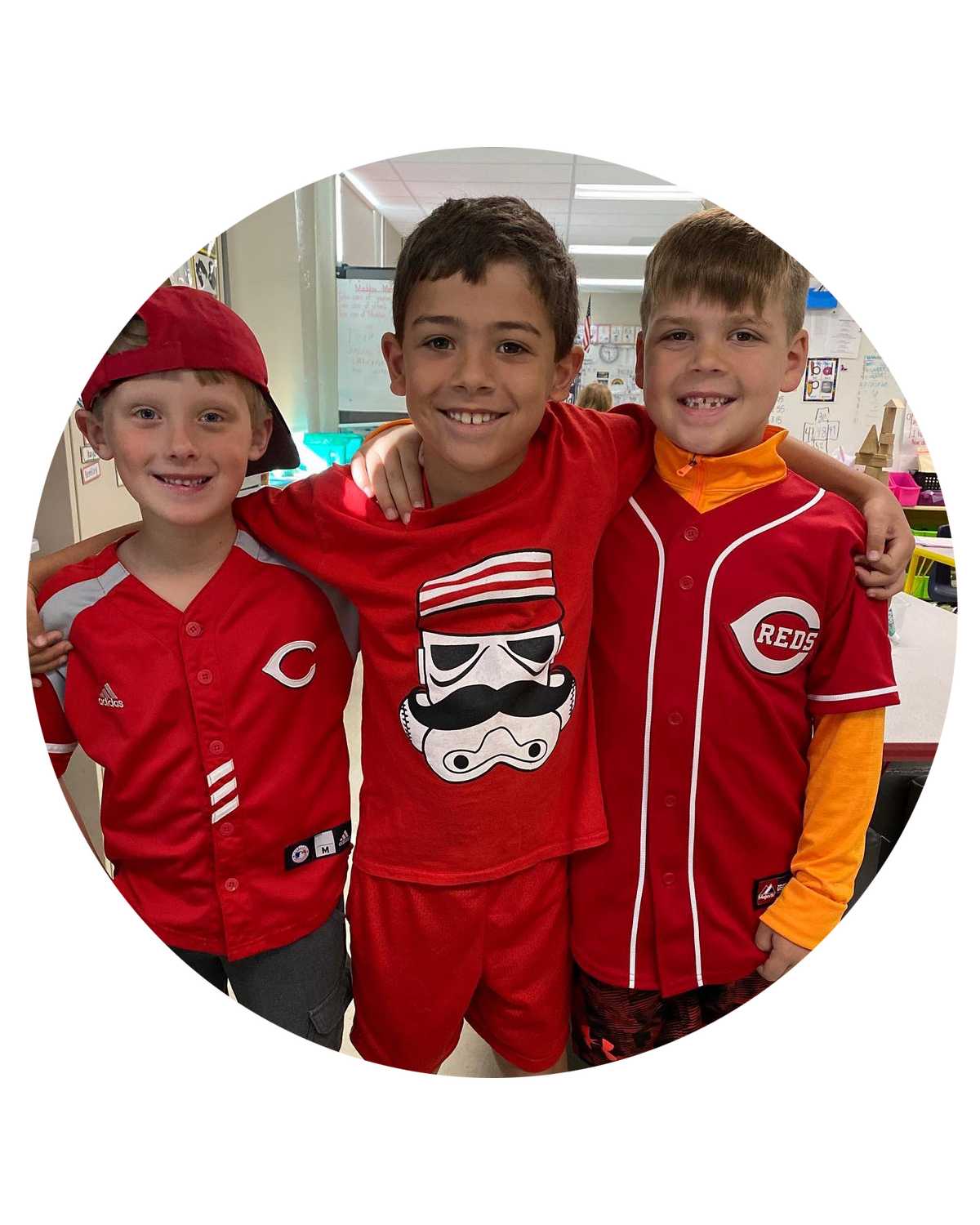 Three students wearing Cincinnati Reds shirts