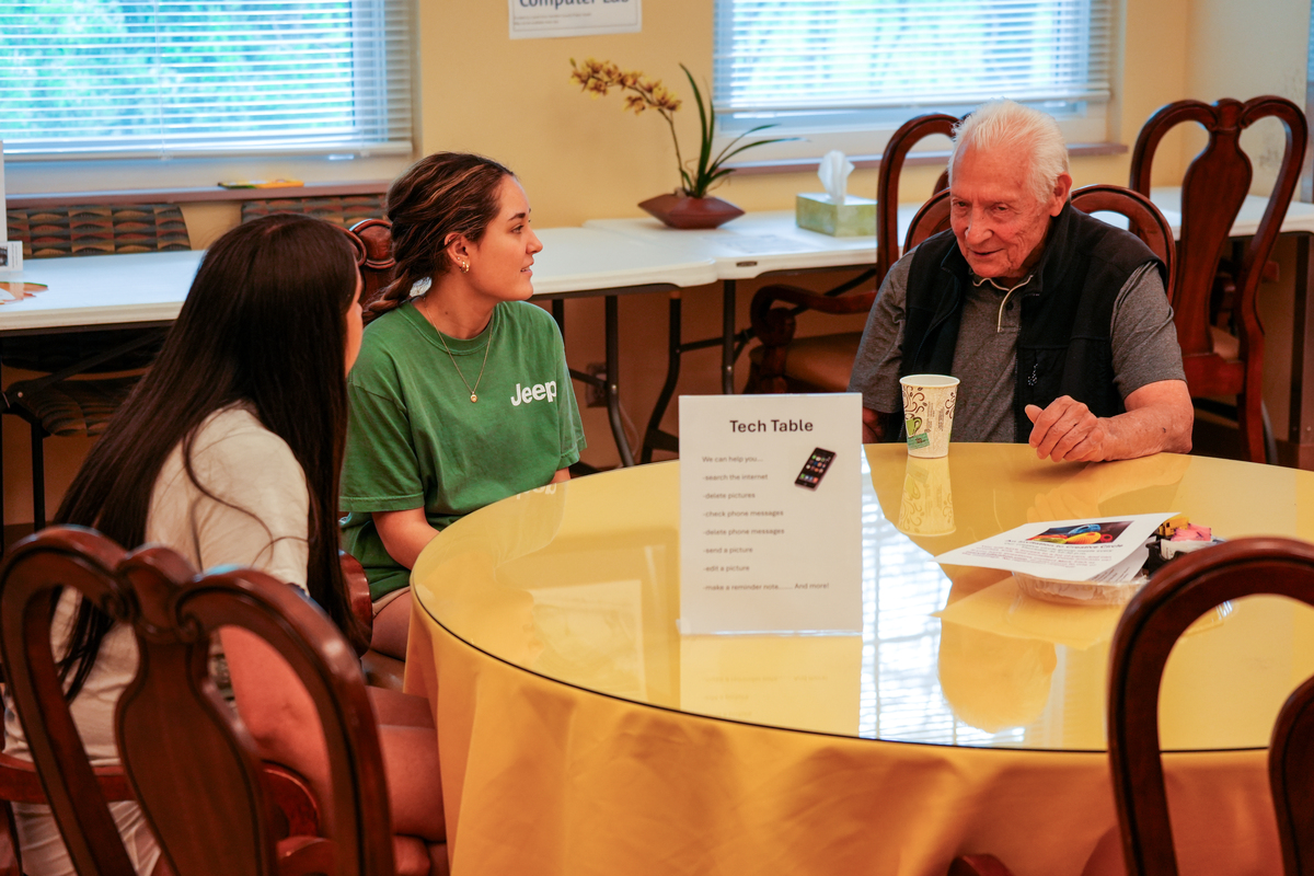 Students providing tech support at the Anderson Township Senior Center