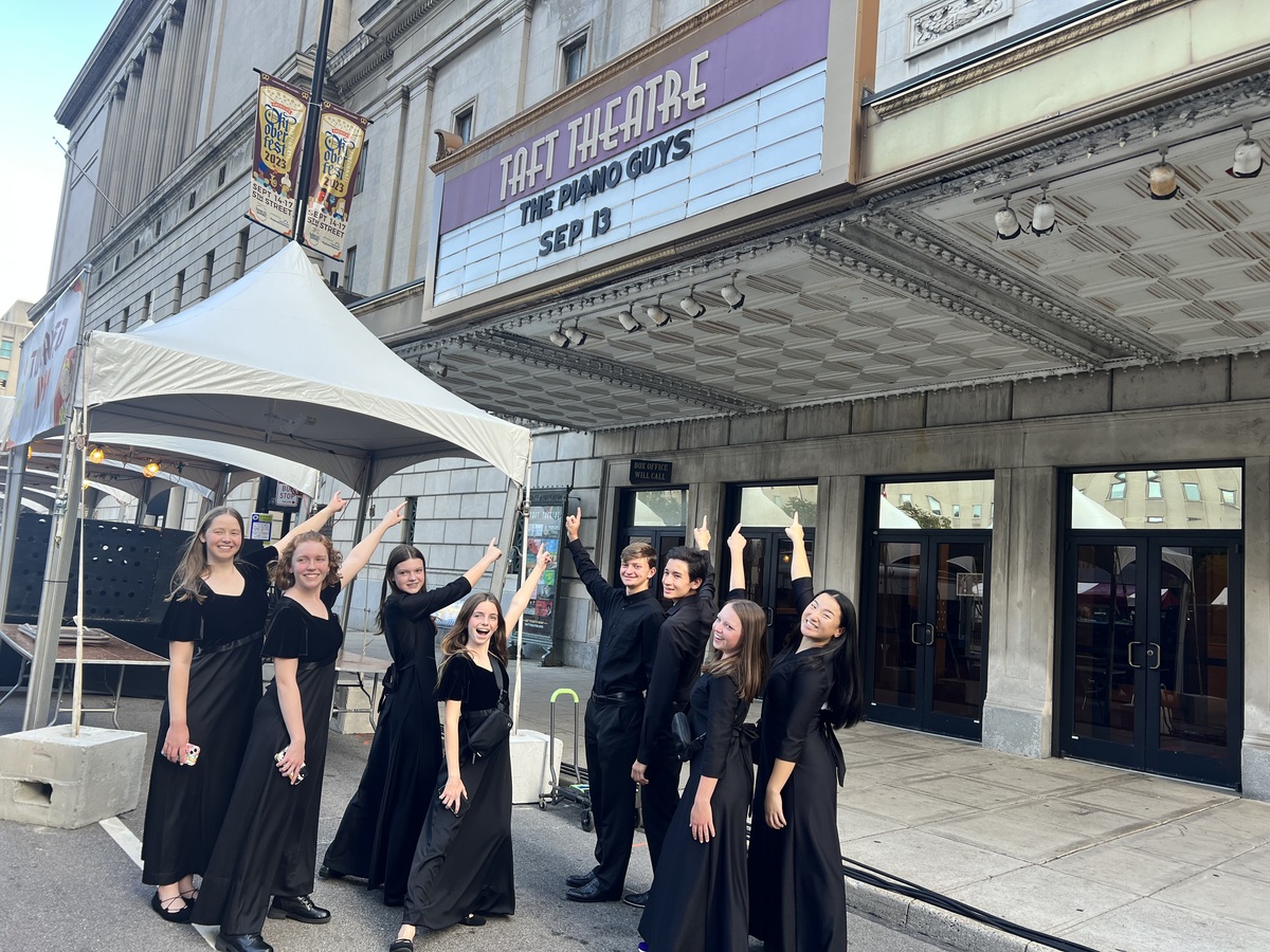 Orchestra students pose for a photo outside Taft Theatre