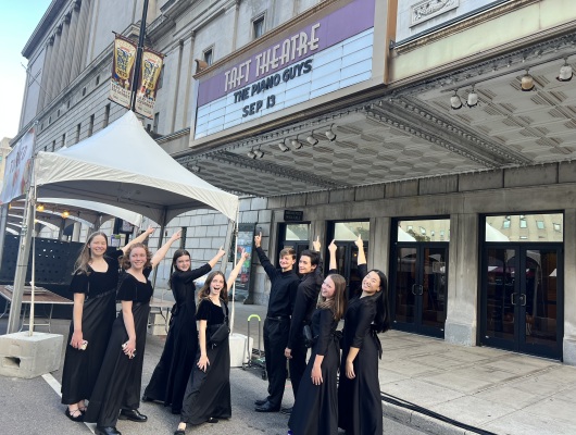 Orchestra students pose for a photo outside Taft Theatre