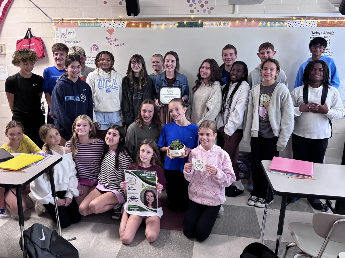 group photo of Alex Liston and her students with her Seeds of Inspiration award