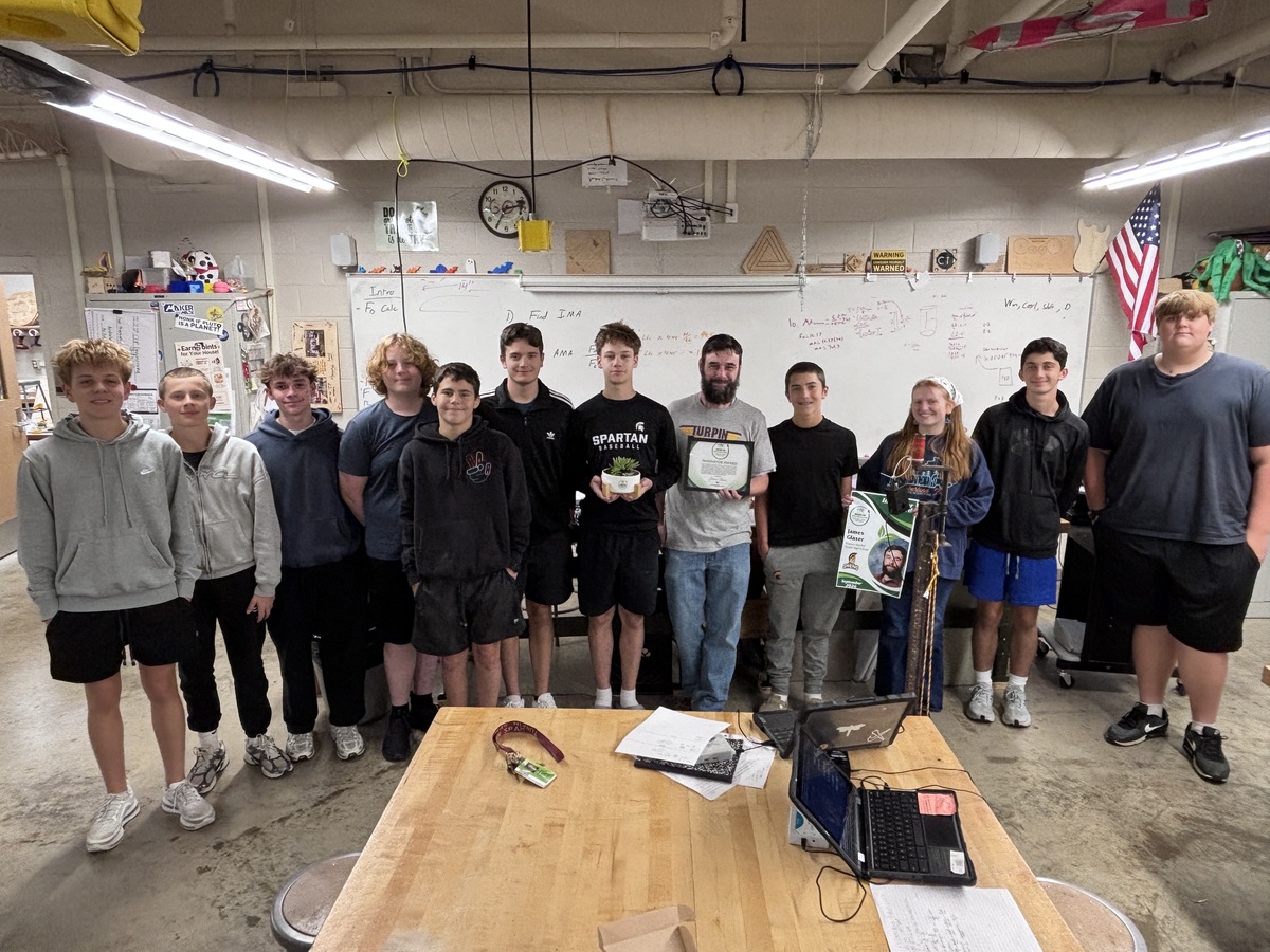 group photo of Mr. Glaser and his students with his Seeds of Inspiration award