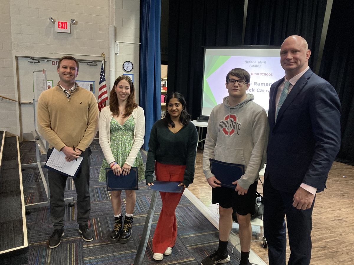 Students and principals pose for a photo.