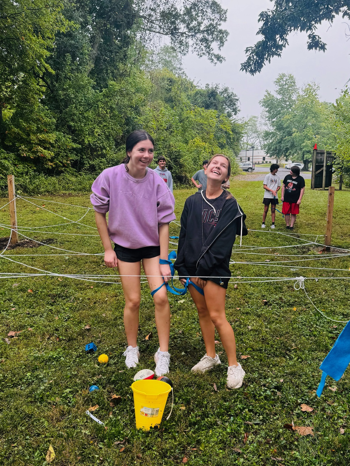 Two students in the program participate in ropes course